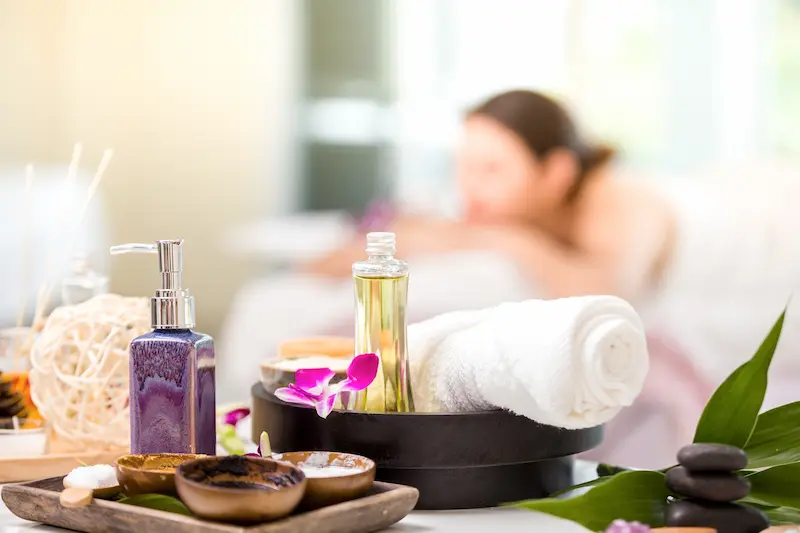 Elegant spa treatment setup with orchid flowers and wellness products