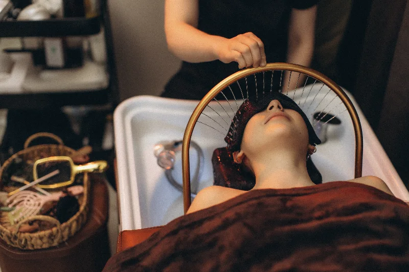 Guest receiving a relaxing Japanese-inspired head spa scalp treatment